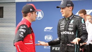 george russell explains to charles leclerc in parc ferme planetf1