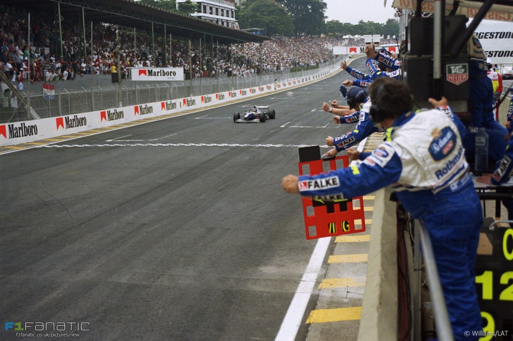 Interlagos, Sao Paulo, Brazil. 28th - 30th March 1997 Jacques Villeneuve (Williams FW19 Renault) wins the race to the cheers of the team. Action. Photo: LAT Photographic/Williams F1 ref: 35mm Negative 1997Williams32