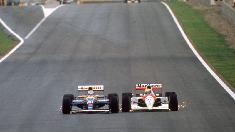 Nigel Mansell and Ayrton Senna are side by side with sparks flying during the 1991 Spanish Grand Prix 800x4501 1